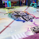 Arcade game with colorful lights and branding on a table